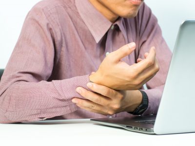 Young,Man,Holding,His,Painful,Wrist,Arm,.,Sprain,Pain